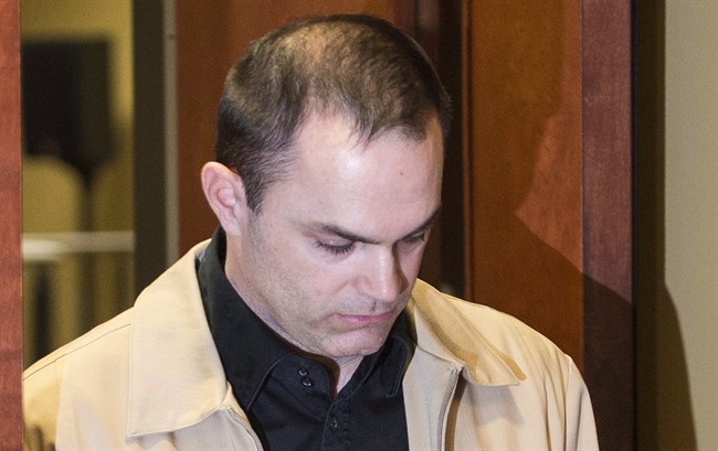 Guy Turcotte leaves the courtroom at the Saint Jérôme courthouse in 2015.