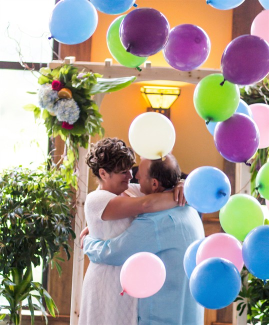 Maurice Robichaud and Patricia Galbraith embrace at their wedding in the summer of 2015 in a handout photo. 