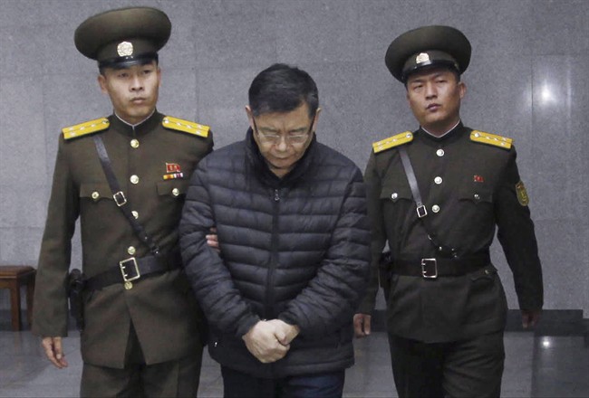 Hyeon Soo Lim, center, who pastors the Light Korean Presbyterian Church in Toronto, is shown being escorted to his sentencing in Pyongyang, North Korea, Wednesday, Dec. 16, 2015.