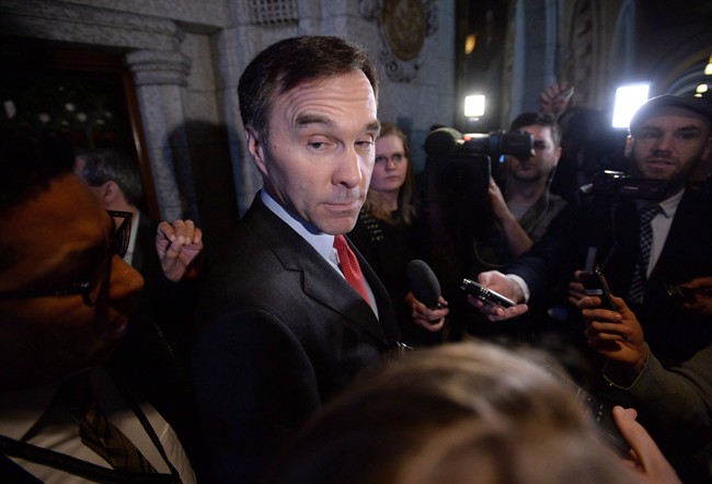 Finance Minister Bill Morneau speaks to reporters following a Liberal cabinet meeting on Parliament Hill in Ottawa on Tuesday, Feb. 2, 2016. 