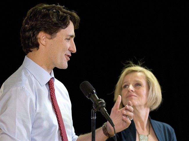 A man has been charged with two counts of uttering threats against Justin Trudeau and Rachel Notley.
