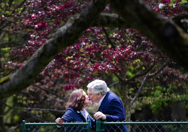 Conrad Black, right, kisses his wife Barbara Amiel Black as he arrives at his Bridle Path residence in Toronto on Friday, May 4, 2012. Former press baron Conrad Black is looking to sell his 23,000-square-foot home in Toronto's exclusive Bridle Path neighbourhood. Nestled on a 6.6-acre lot, the nine-bedroom property that includes a caretaker suite and a converted coach house will hit the auction block on March 8.