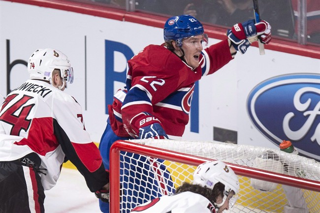 Montreal Canadiens' Dale Weise, right, celebrates his power play goal against the Ottawa Senators during second period NHL hockey action, in Montreal, on Tuesday, Nov. 3, 2015. Weise and teammate Tomas Fleischmann have been traded by the Montreal Canadiens to the Chicago Blackhawks.