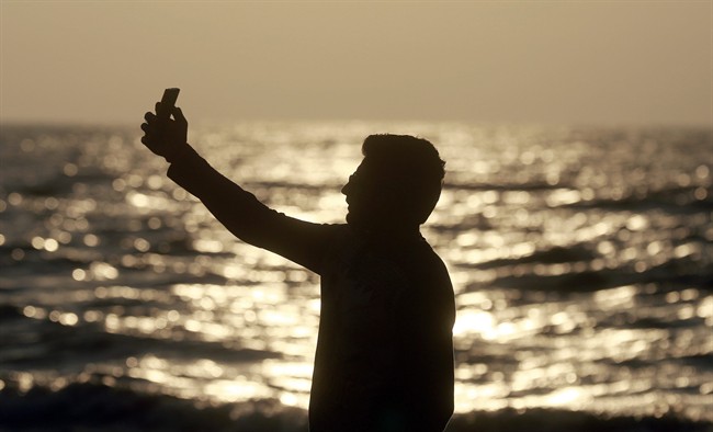 In this Feb. 22, 2016, photo, an Indian man takes a selfie in Mumbai's coastline. India is home to the highest number of people who have died while taking photos of themselves, with 19 of the world’s 49 recorded selfie-linked deaths since 2014, according to San Francisco-based data service provider Priceonomics. The statistic may in part be due to India’s sheer size, with 1.25 billion citizens and one of the world’s fastest-growing smartphone markets.