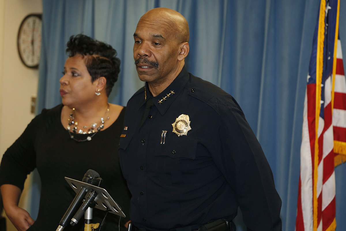 Denver Police Chief Robert White, front, talks while Stephanie O'Malley, manager of safety, looks on during a news conference late Saturday, Jan. 30, 2016, in Denver. 