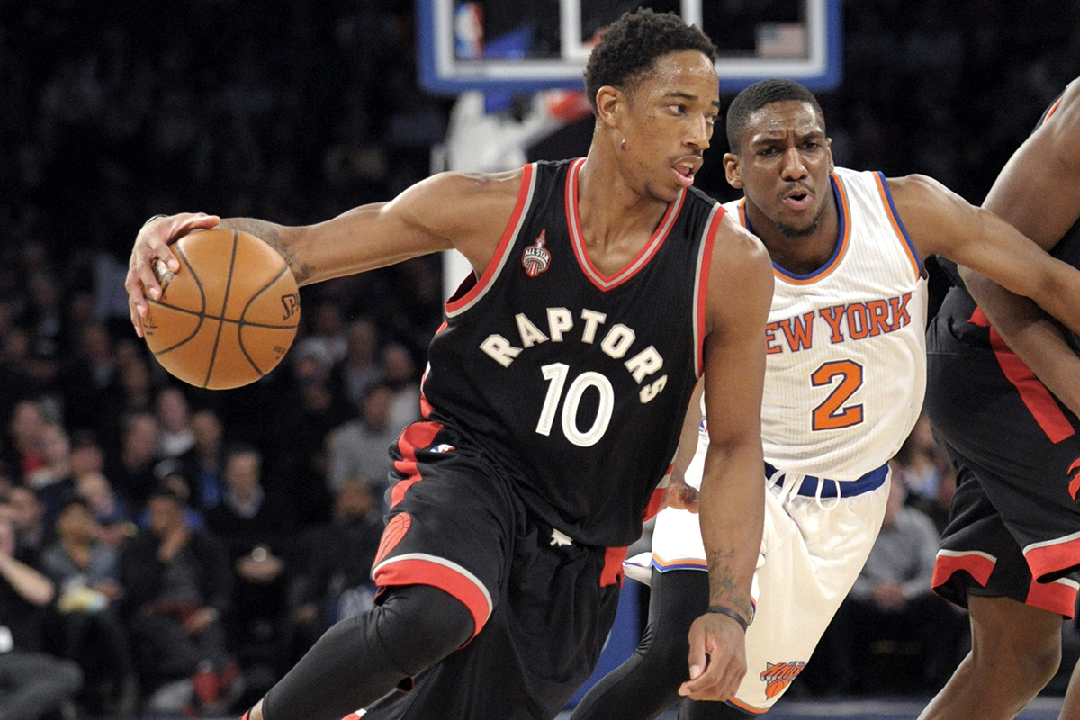 Toronto Raptors guard DeMar DeRozan drives the basket as New York Knicks guard Langston Galloway.
