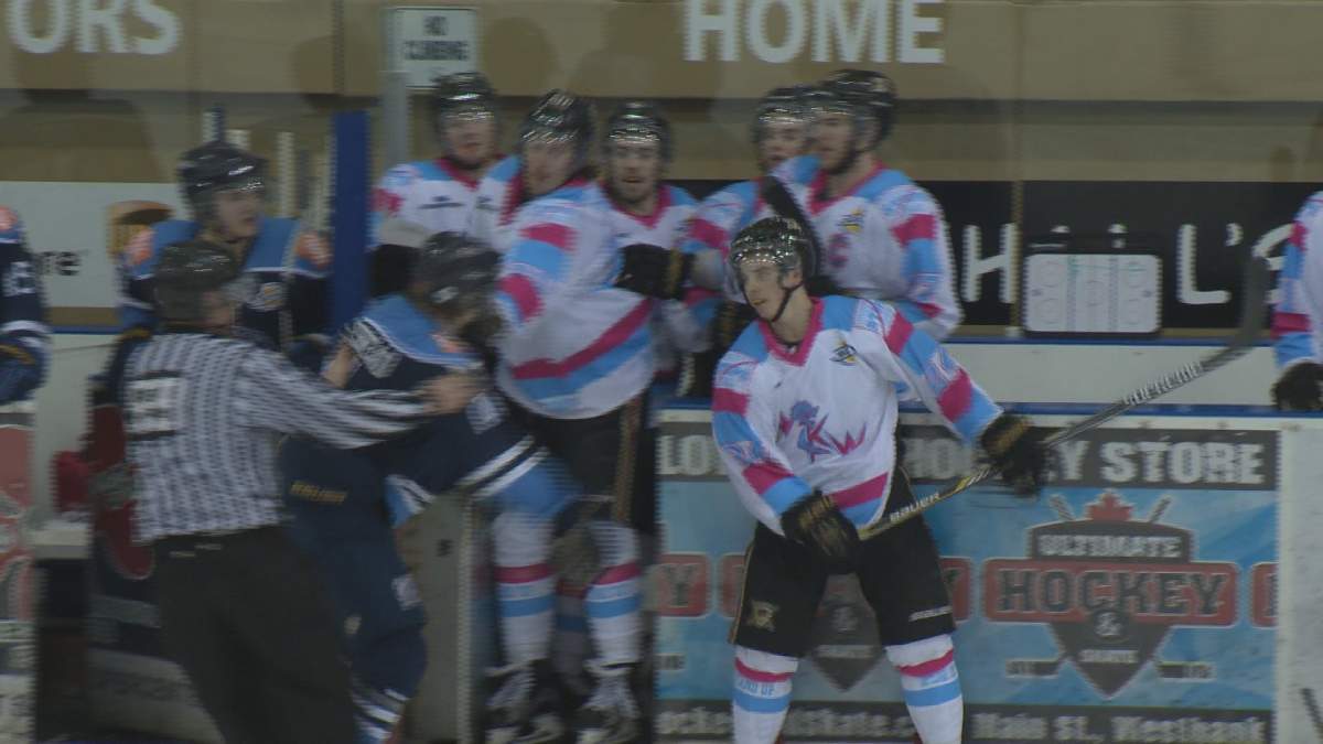 Jonathan Desbiens, franchise-leading scorer with the West Kelowna Warriors backs away from Christian Cakebread of the Vernon Vipers. Desbiens became a target during Friday night's game after scoring two goals, his 43rd and 44th of the season, a record for the franchise.
