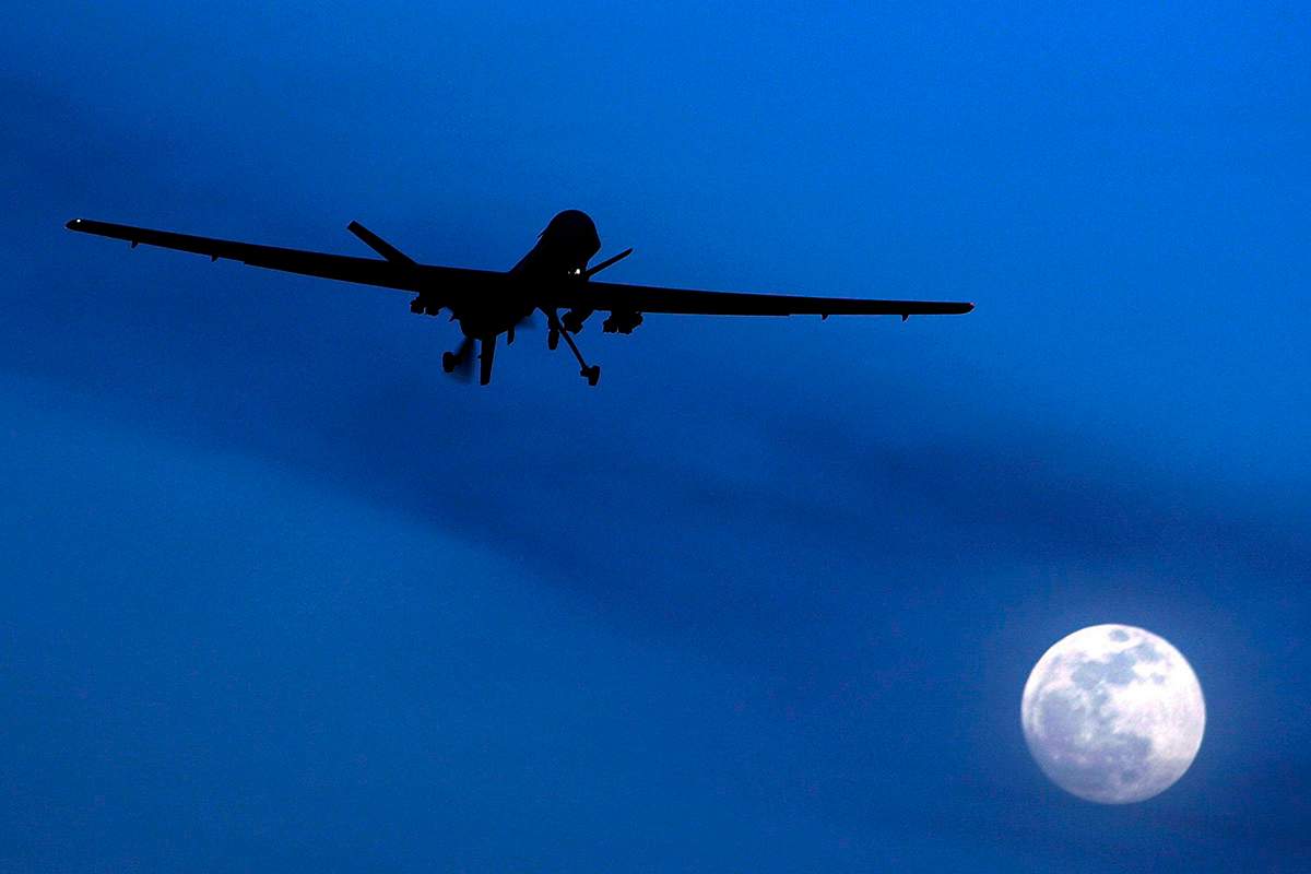 In this Jan. 31, 2010 file photo, an unmanned U.S. Predator drone flies over Kandahar Air Field, southern Afghanistan, on a moon-lit night.  