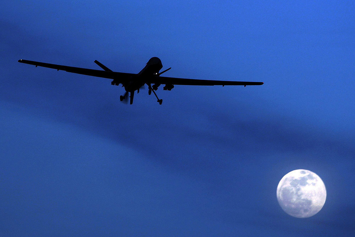 In this Jan. 31, 2010 file photo, an unmanned U.S. Predator drone flies over Kandahar Air Field, southern Afghanistan, on a moon-lit night.  