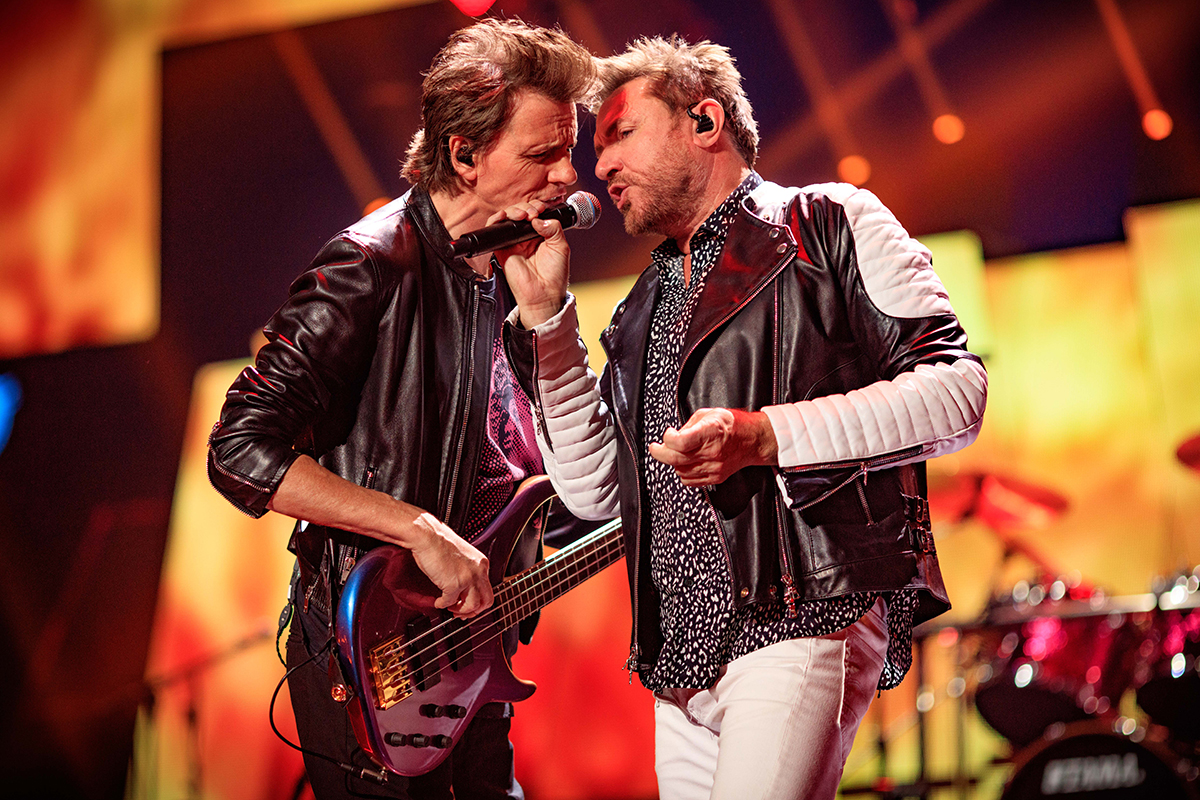 Musician John Taylor (L) and singer Simon Le Bon of Duran Duran perform onstage at the 2015 iHeartRadio Music Festival at MGM Grand Garden Arena on September 18, 2015 in Las Vegas, Nevada.