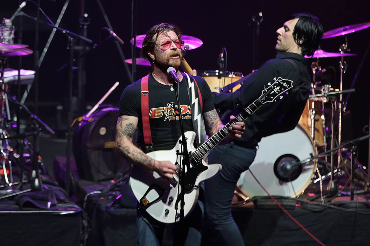 Jesse Hughes (L), the singer of US rock group Eagles of Death Metal, performs on stage at the Olympia concert hall in Paris, on February 16, 2016.