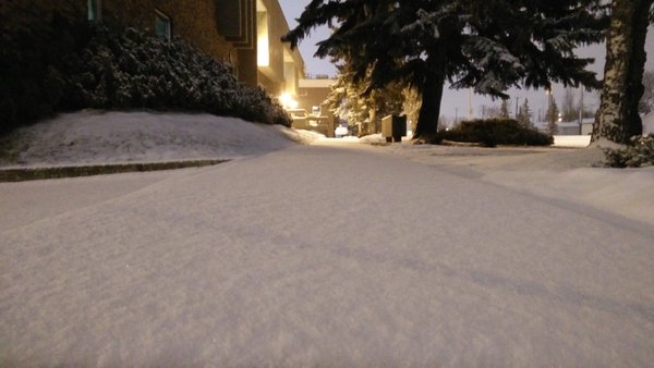 A sidewalk outside Global Edmonton is covered with snow, Thursday, Feb. 11, 2016. 