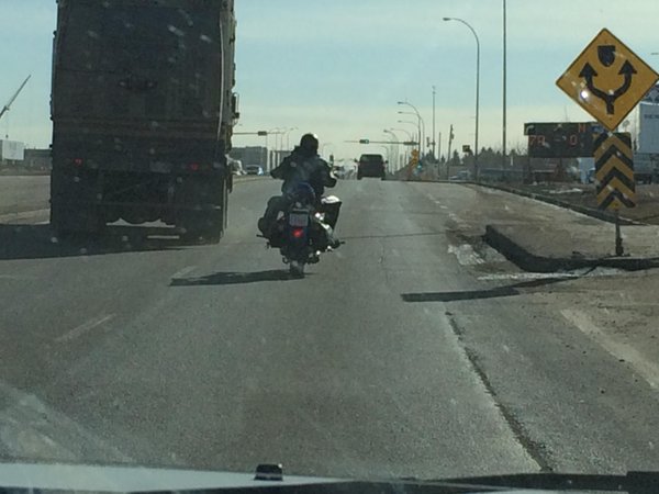 A motorcyclist takes a mid-February ride in Sherwood Park as temperatures soar into the low teens.