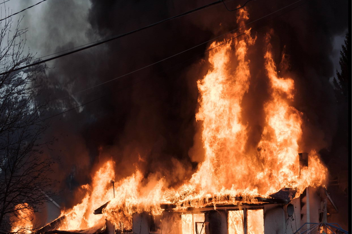 A fire burns down a home in Fernie, B.C. on February 13, 2016. 