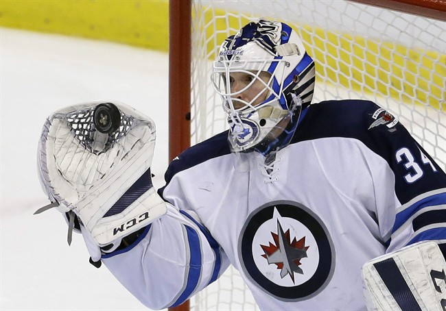 Winnipeg Jets goalie Michael Hutchinson makes a save against the Florida Panthers on February 20, 2016, in Sunrise, Fla.