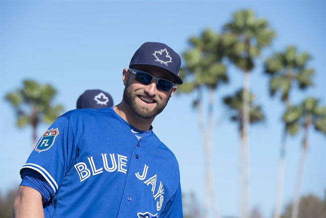 Toronto Blue Jays outfielder Kevin Pillar smiles as he takes the field after arriving at spring training in Dunedin, Fla., on Tuesday February 23, 2016. THE CANADIAN PRESS/Frank Gunn.