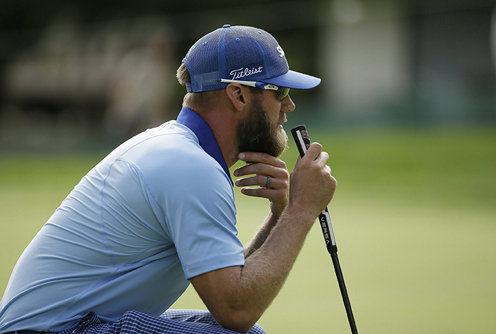 Graham DeLaet shows off his beard at the Frys.com golf tournament Saturday, Oct. 17, 2015, in Napa, Calif.