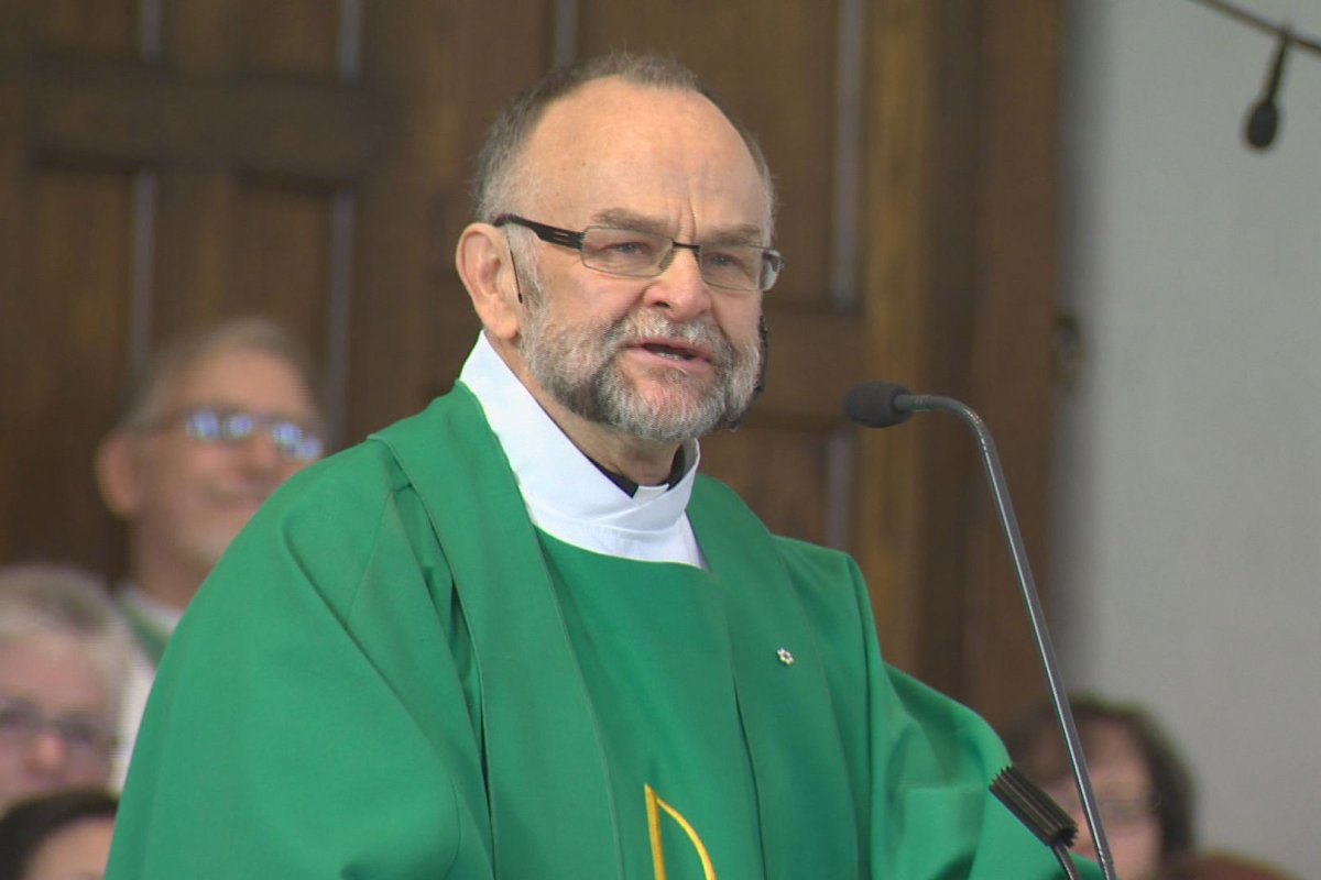 Rev. Brent Hawkes told his congregation he is innocent of two charges dating back to the 1970s. 