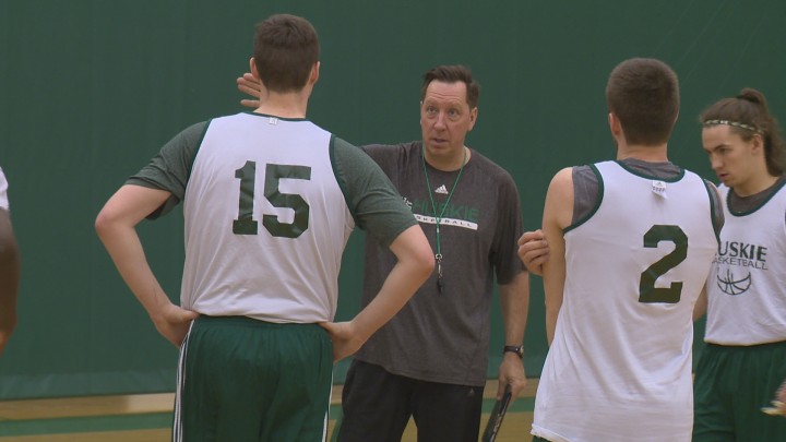 Huskies men's basketball coach Barry Rawlyk gives instructions at a recent practice.