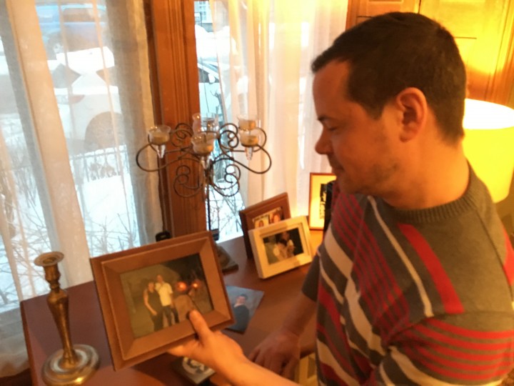 Martin Pilon looks at a picture of him and his mother, Monday February 29, 2016.