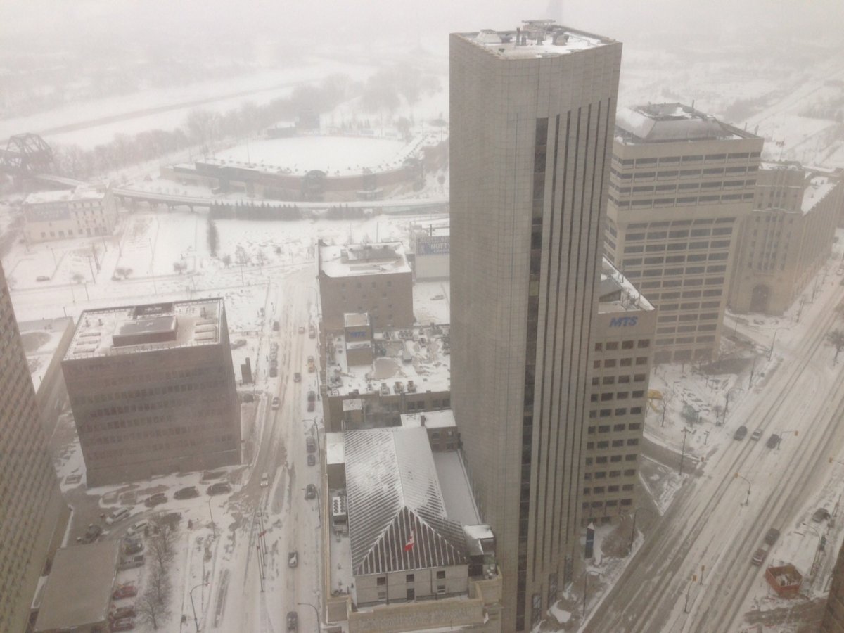 Visibility was poor due to blowing snow at the intersection of Portage and Main.