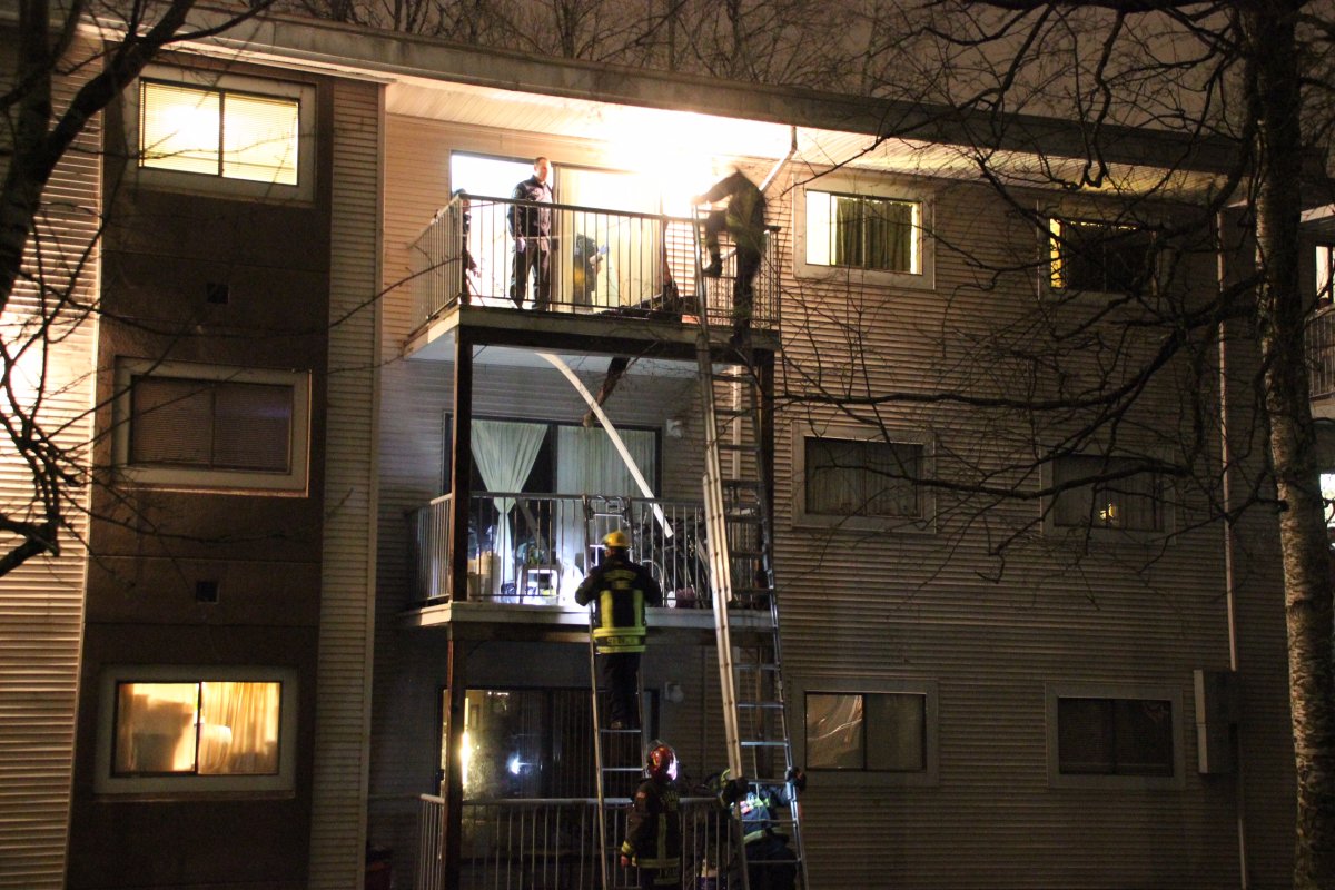 Fire crews rescue a man trapped in a balcony in Surrey on February 5, 2016. 