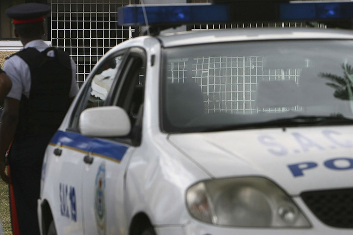 A police car is parked outside a hospital in Kingston, Jamaica in this file photo. 