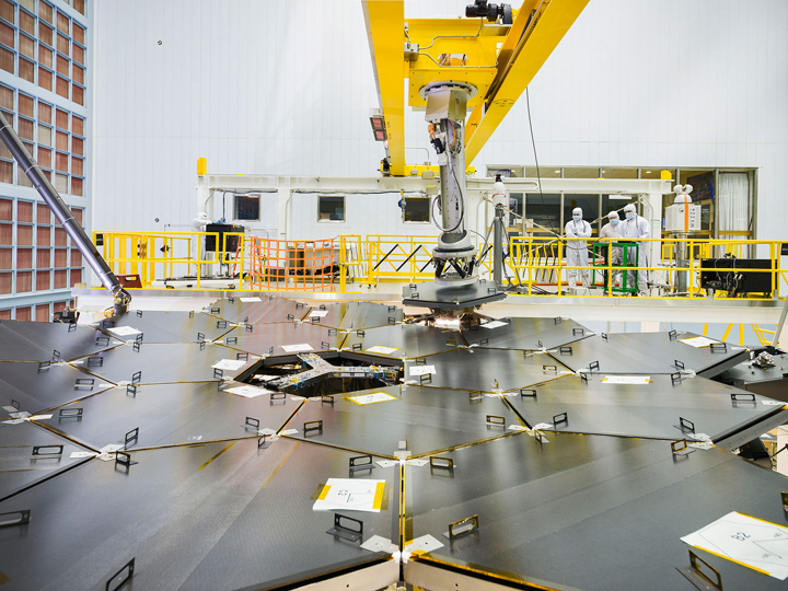 Inside a massive clean room at NASA's Goddard Space Flight Center in Greenbelt, Maryland the James Webb Space Telescope team used a robotic am to install the last of the telescope's 18 mirrors onto the telescope structure.