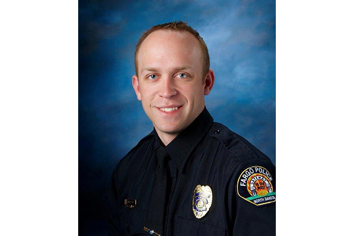 This undated photo released by Fargo Police Department shows officer Jason Moszer. 