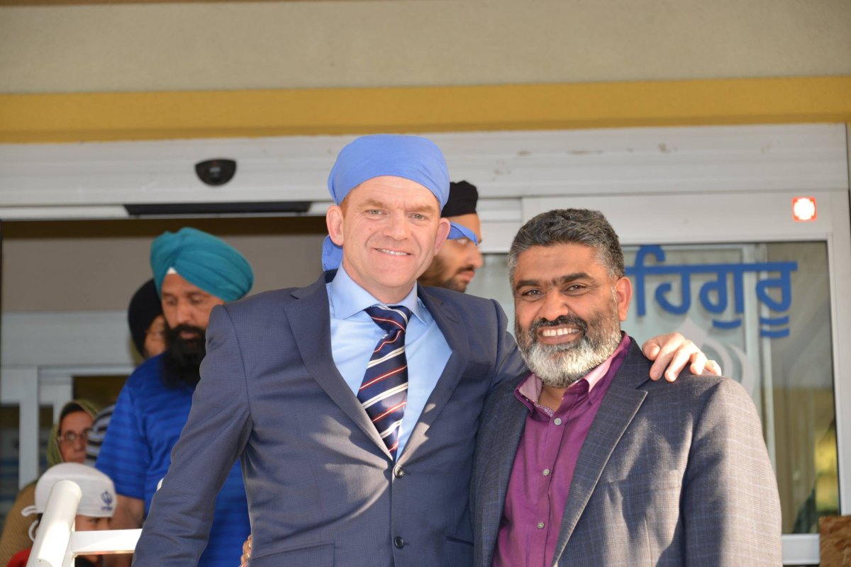 Wildrose leader Brian Jean (left) poses with Devinder Toor (right) who is the party's candidate for the March 22 byelection for Calgary-Greenway.
