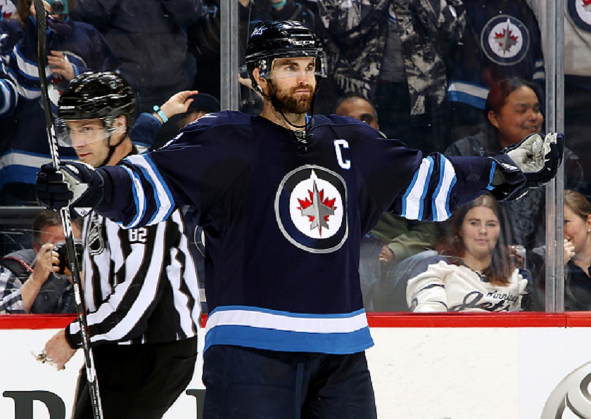 WINNIPEG, MB - FEBRUARY 23: Andrew Ladd #16 of the Winnipeg Jets raises his arms in celebration of his second period short-handed goal against the Dallas Stars at the MTS Centre on February 23, 2016 in Winnipeg, Manitoba, Canada. (Photo by Jonathan Kozub/NHL via Getty Images).