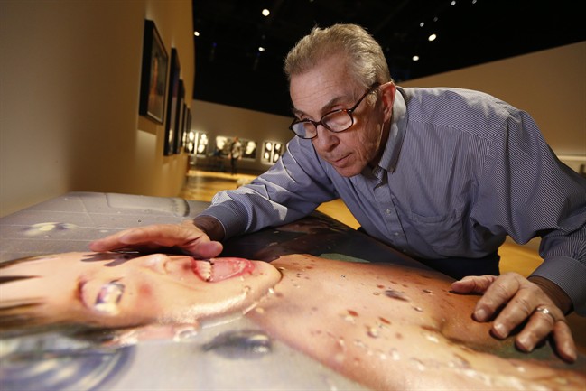 Co-founder of 3DPhotoworks, former LIFE magazine photographer John Olson of New York, shows off his new 3D printing technology heralded as a breakthrough for people with vision loss, allowing them to "see" photographs and fine art with their fingertips at The Canadian Museum for Human Rights.