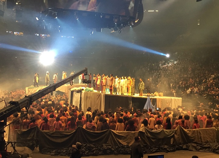 Models stand on stage as Kanye West presents his Yeezy collection at Madison Square Garden during Fashion Week, Thursday, Feb. 11, 2016, in New York.