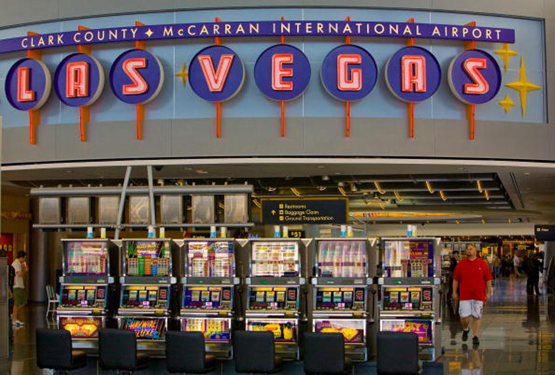 The lure of slot machines beckons travellers at the United Airlines Terminal at McCarran International Airport.