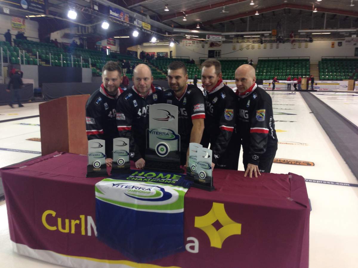Mike McEwen and his team of BJ Neufeld, Matt Wozniak, Denni Neufeld and coach Jon Mead pose with the trophy after winning the Viterra Championship.