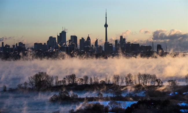 Steam rises from Lake Ontario in front of the skyline during extreme cold weather in Toronto on Saturday, February 13, 2016.