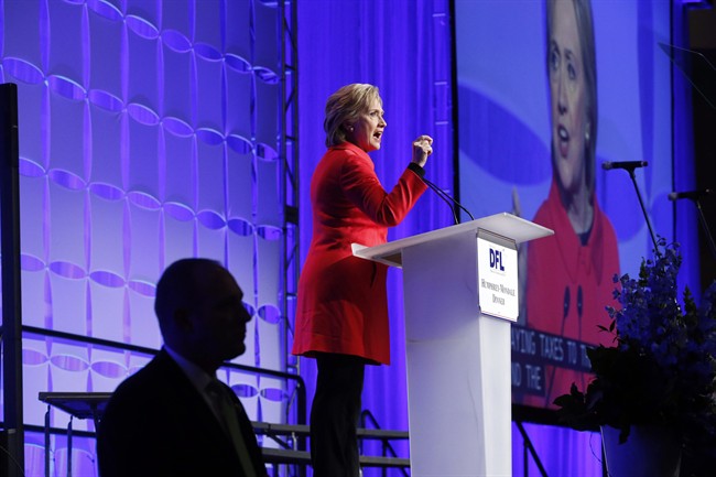 Democratic presidential candidate, Hillary Clinton acknowledges the crowd as she arrives to speak at the state's Democratic-Farmer-Labor (DFL) Humphrey-Mondale dinner, Friday, Feb. 12, 2016, in St. Paul, Minn.