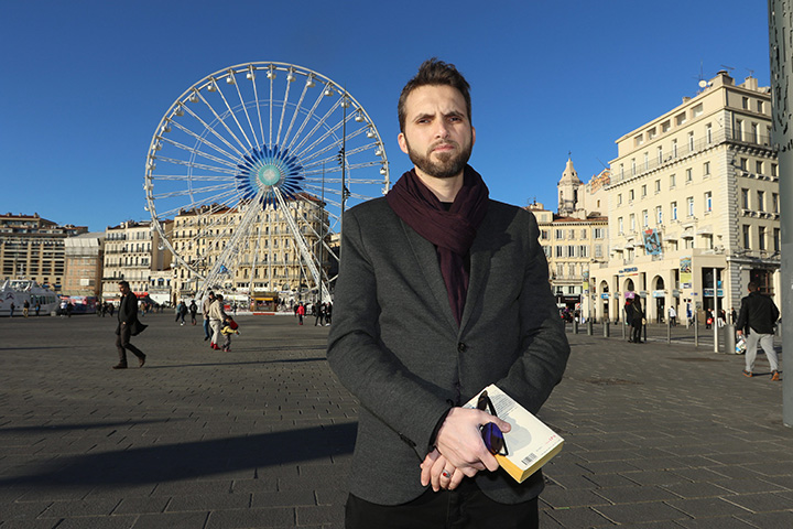 In this Wednesday, February 2, 2016 Imam Ludovic-Mohamed Zahed, poses on the Old-Port, in Marseille, southern France. 