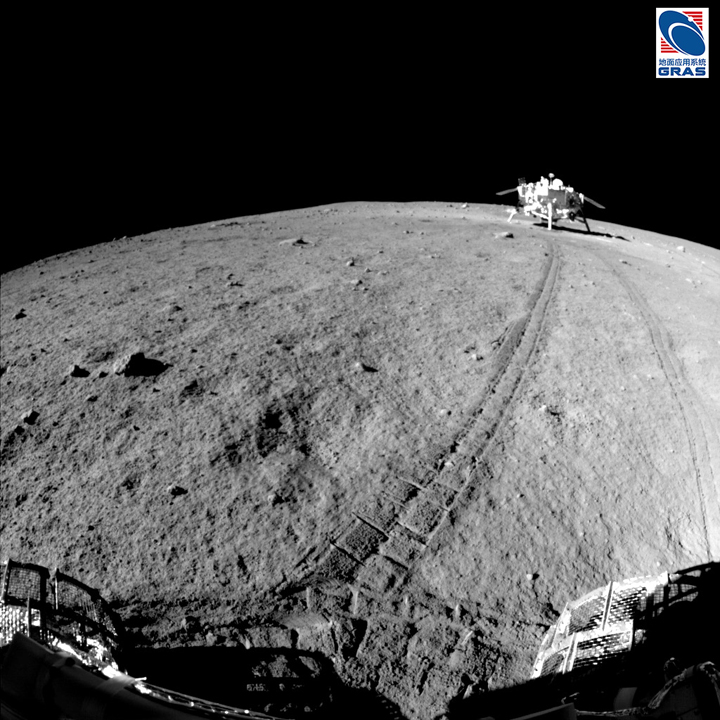 Tracks of the China National Space Administration's Yutu rover cross the surface of the moon.