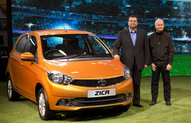 Tata Motors Chairman Cyrus Mistry, left, and Tim Leverton, head of Tata Engineering and Research and Development, pose for photographers during the unveiling of Zica at a press preview of Auto Expo in Greater Noida, near New Delhi, India, Wednesday, Feb. 3, 2016. The Zika virus has hit India's Tata Motors, which has decided to rebrand soon-to-be launched hatchback vehicle which was to have been called Zica, an abbreviation of "Zippy Car." Tata Motors said in a statement Tuesday that the car would carry the Zica nameplate during the exhibition, but a new name will be announced in a few weeks. (AP Photo/Manish Swarup).
