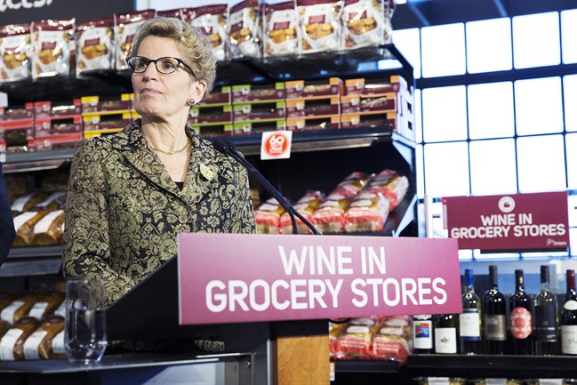 Ontario Premier Kathleen Wynne appears at a press conference in a Toronto supermarket on Thursday, Feb. 18, 2016 to formally announce that her government will open up wine sales in grocery stores across Ontario.