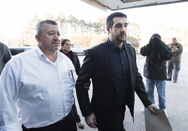 Marco Muzzo, right, arrives with family at the court house for his sentencing hearing in Newmarket, Ont., on Tuesday, February 23, 2016. Muzzo, 29, pleaded guilty earlier this month to four counts of impaired driving causing death and two of impaired driving causing bodily harm. THE CANADIAN PRESS/Nathan Denette.
