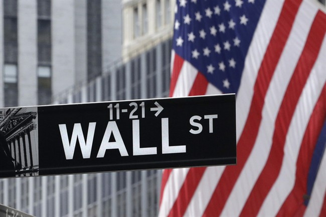 American flags fly at the New York Stock Exchange on Wall Street, July 6, 2015. 