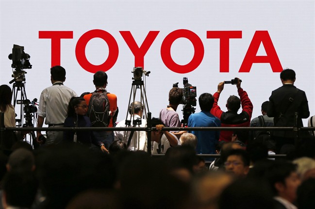 Toyota Motor Corp.'s booth is crowded with visitors in the media preview of the Tokyo Motor Show in Tokyo.