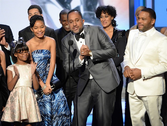 In this Feb. 5, 2016 file photo, Marsai Martin, from left, Yara Shahidi, creator Kenya Barris, at microphone, Tracee Ellis Ross and Anthony Anderson accept the award for outstanding comedy series for "Black-ish" at the 47th NAACP Image Awards in Pasadena, Calif.