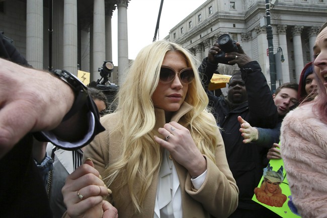 Pop star Kesha leaves Supreme court in New York, Friday, Feb. 19, 2016. 