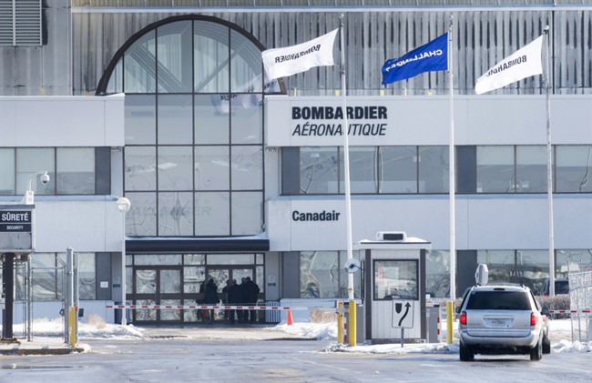 People enter a Bombardier plant, Wednesday, February 17, 2016 in Montreal. 