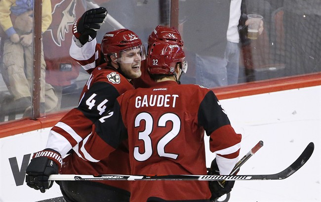 Arizona Coyotes' Kevin Connauton (44) celebrates his goal against the Montreal Canadiens with Tyler Gaudet (32) and Kyle Chipchura during the second period of an NHL hockey game Monday, Feb. 15, 2016, in Glendale, Ariz.