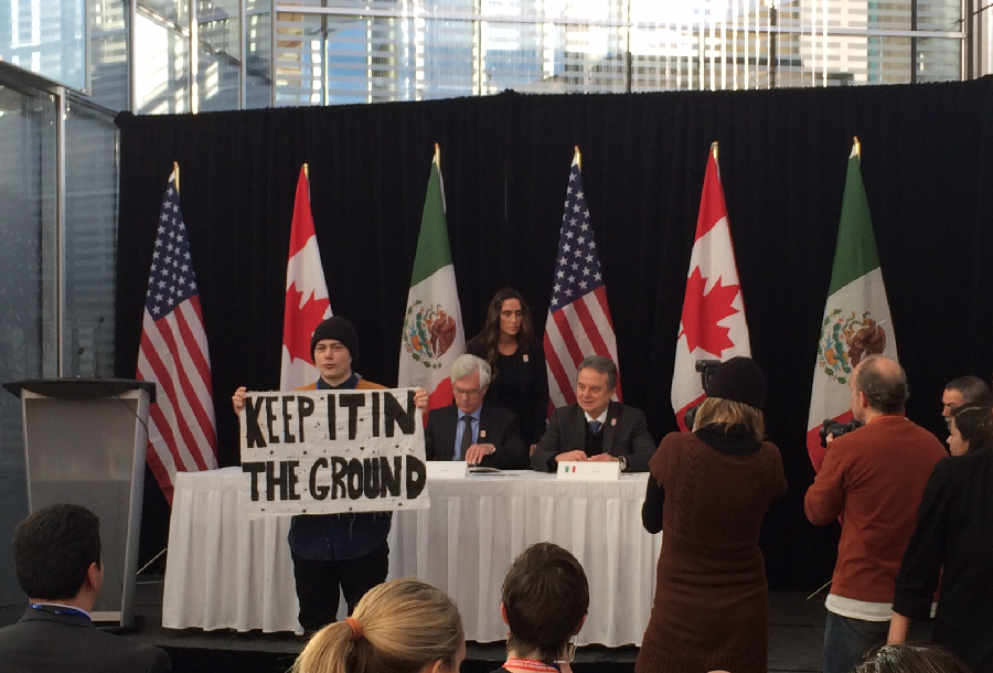 Protester interrupting climate change conference in Winnipeg Friday morning.
