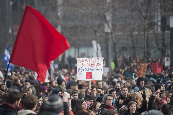 Protesters fly the red square as they oppose Quebec student tuition fee increases, Montreal, Tuesday, February 26, 2013.